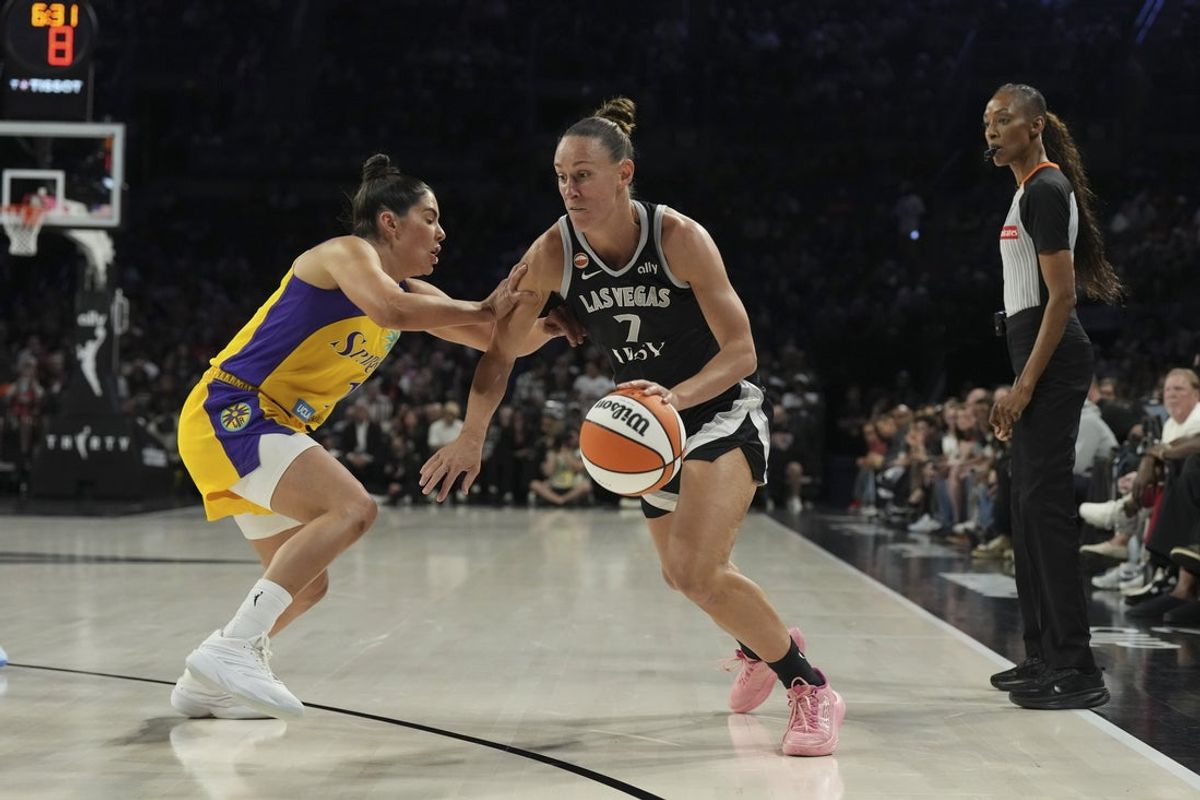May 23, 2026; Las Vegas, Nevada, USA; Las Vegas Aces forward Stephanie Talbot (7) dribbles against Los Angeles Sparks guard Kelsey Plum (10) in the first quarter of their game at Michelob Ultra Arena. Mandatory Credit: Candice Ward-Imagn Images