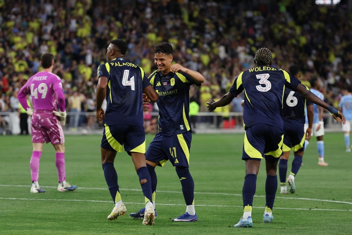 May 23, 2026; Nashville, Tennessee, USA; Nashville SC defender Jeisson Palacios (4)celebrates with forward Warren Madrigal (41) after scoring a goal against New York City FC during the first half at Geodis Park. Mandatory Credit: Alan Poizner-Imagn Images