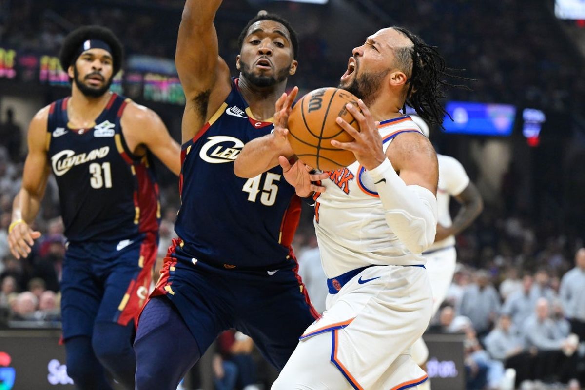 May 23, 2026; Cleveland, Ohio, USA; New York Knicks guard Jalen Brunson (11) drives the ball while defended by Cleveland Cavaliers guard Donovan Mitchell (45) in the third quarter during game three of the eastern conference finals for the 2026 NBA playoffs at Rocket Arena. Mandatory Credit: David Richard-Imagn Images