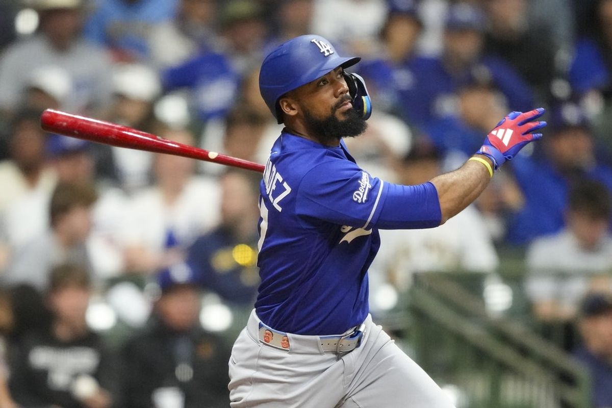 May 23, 2026; Milwaukee, Wisconsin, USA;  Los Angeles Dodgers left fielder Teoscar Hernandez (37) hits an RBI single during the ninth inning against the Milwaukee Brewers at American Family Field. Mandatory Credit: Jeff Hanisch-Imagn Images