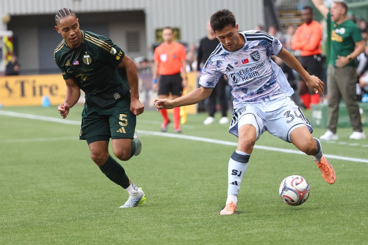 May 23, 2026; Portland, Oregon, USA;  San Jose Earthquakes midfielder Beau Leroux (34) dribbles the bal past Portland Timbers defender Brandon Bye (5) during the first half at Providence Park. Mandatory Credit: Jaime Valdez-Imagn Images