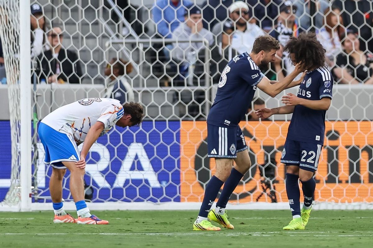 May 23, 2026; San Diego, California, USA; Vancouver Whitecaps FC midfielder Thomas Muller (13) and forward Aziel Jackson (22) celebrate a goal scored by forward Brian White (not pictured) against San Diego FC during the first half at Snapdragon Stadium. Mandatory Credit: Chadd Cady-Imagn Images
