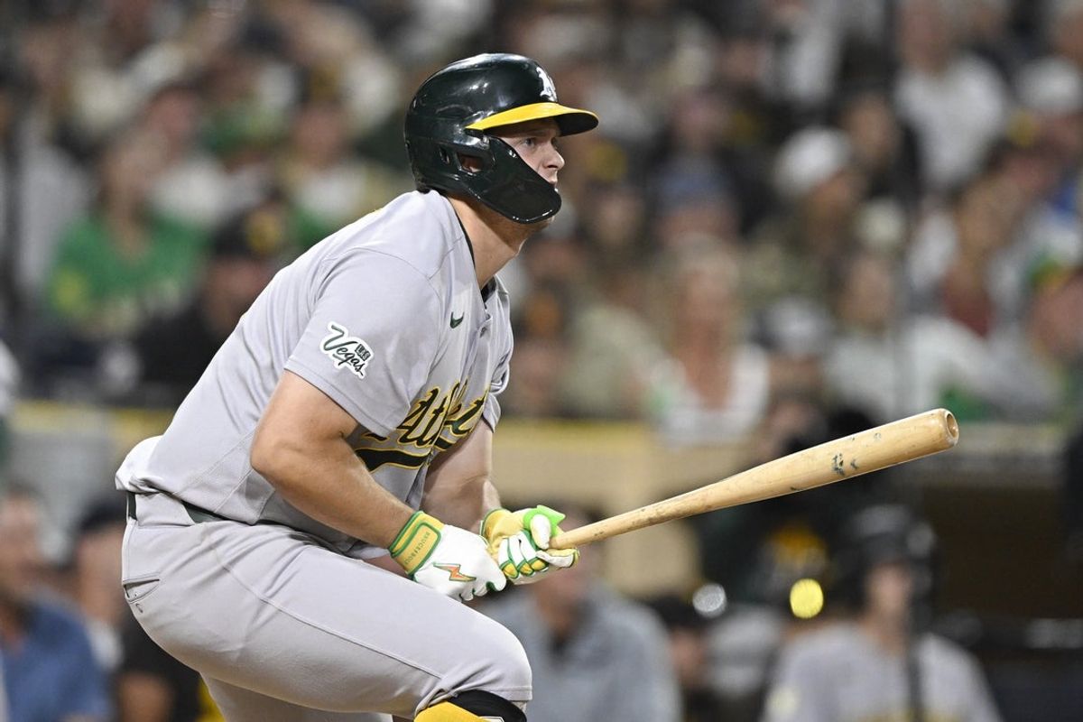 May 23, 2026; San Diego, California, USA; Athletics first baseman Nick Kurtz (16) hits a single during the fifth inning against the San Diego Padres at Petco Park. Mandatory Credit: Denis Poroy-Imagn Images
