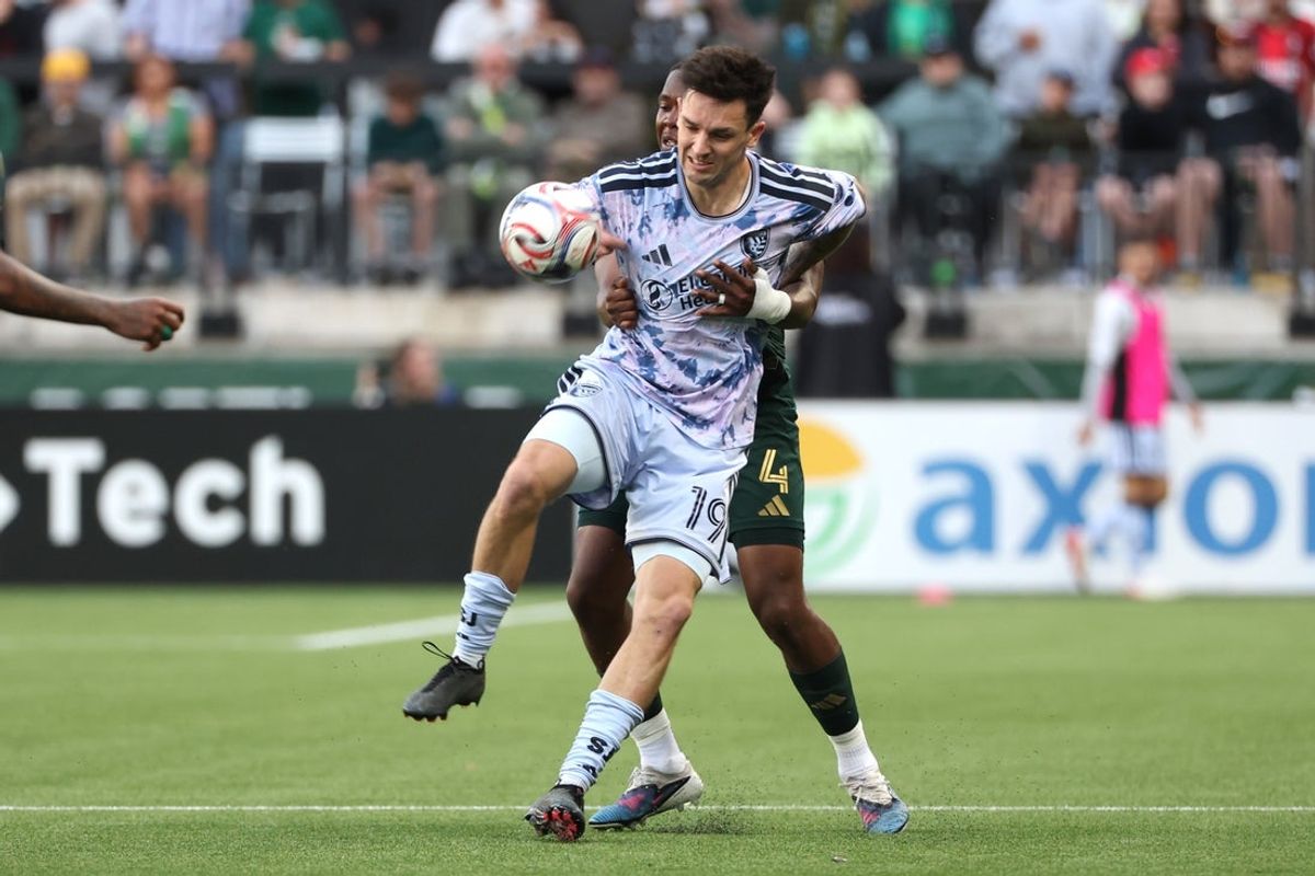 May 23, 2026; Portland, Oregon, USA; San Jose Earthquakes forward Preston Judd (19) tries to fight through hands of Portland Timbers defender Kamal Miller (4) during the second half at Providence Park. Mandatory Credit: Jaime Valdez-Imagn Images