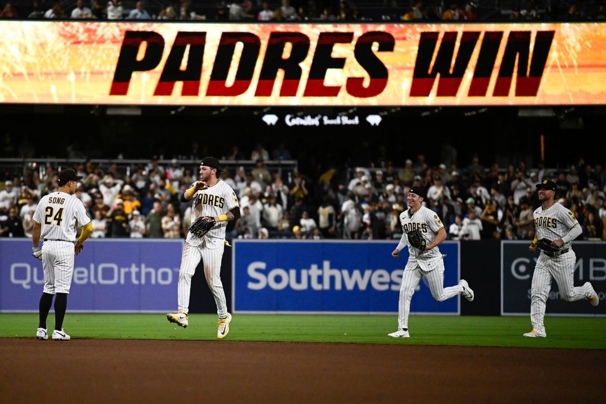 May 23, 2026; San Diego, California, USA; San Diego Padres outfielders Gavin Sheets (30), Bryce Johnson (29) and Jackson Merrill (3) celebrate with shortstop Sung-Mun Song (24) after defeating the Athletics at Petco Park. Mandatory Credit: Denis Poroy-Imagn Images