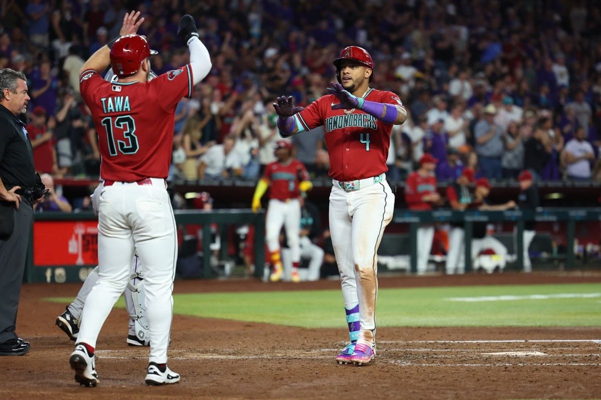 May 23, 2026; Phoenix, Arizona, USA; Arizona Diamondbacks second baseman Ketel Marte (4) celebrates with outfielder Tim Tawa (13) after hitting a two run home run against the Colorado Rockies during the fourth inning at Chase Field. Mandatory Credit: Anna Carrington-Imagn Images