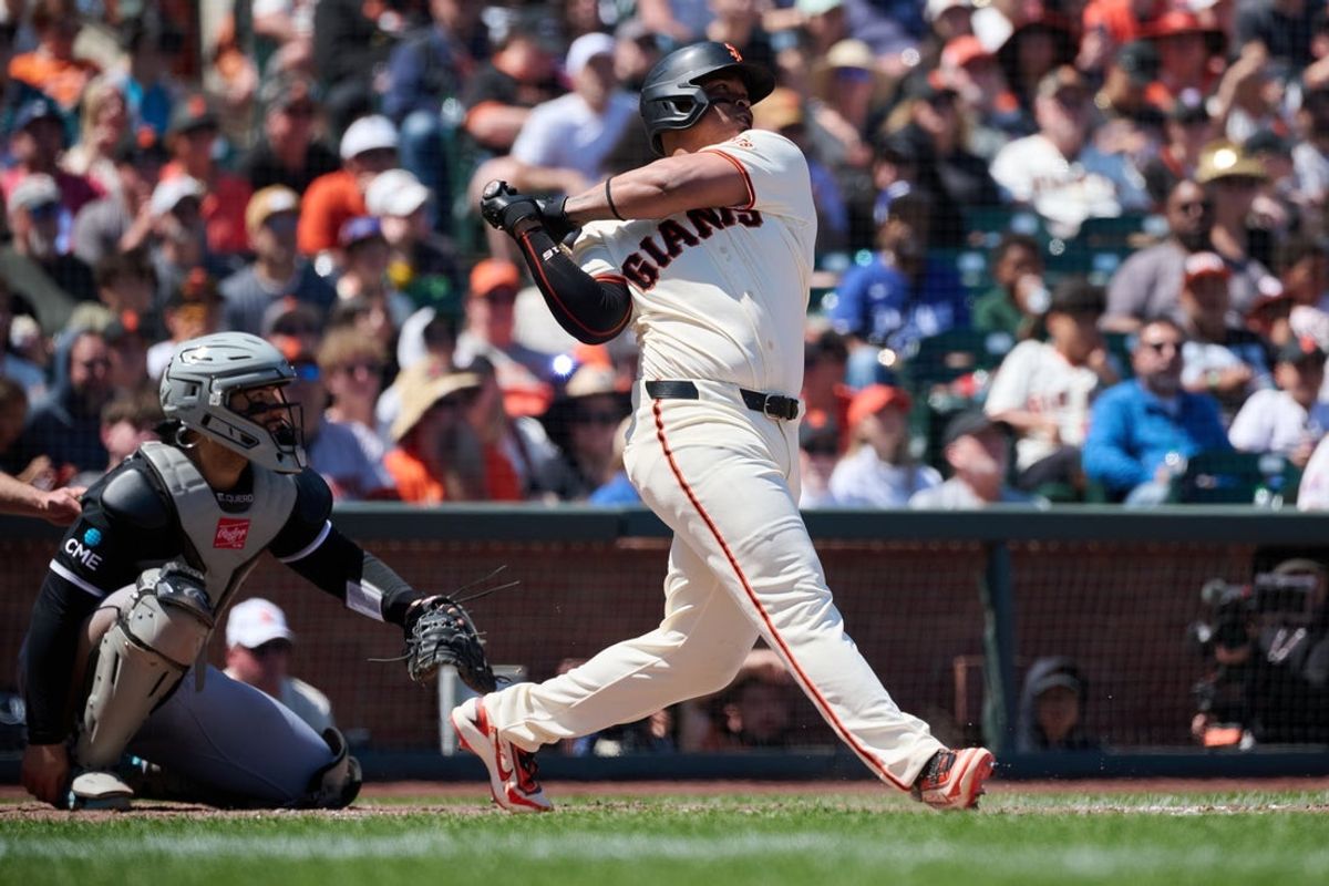 May 24, 2026; San Francisco, California, USA; San Francisco Giants designated hitter Rafael Devers (16) hits a grand slam home run against Chicago White Sox pitcher Grant Taylor (31) during the fifth inning at Oracle Park. Mandatory Credit: Robert Edwards-Imagn Images