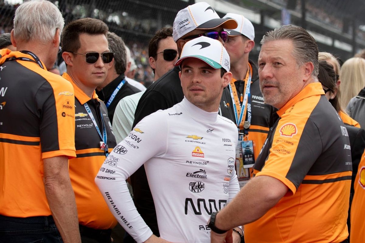 Arrow McLaren driver Pato O'Ward (5) talks with Zak Brown on Sunday, May 24, 2026, ahead of the 110th running of the Indianapolis 500 at Indianapolis Motor Speedway.