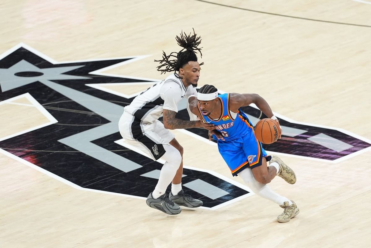 May 24, 2026; San Antonio, Texas, USA; Oklahoma City Thunder guard Shai Gilgeous-Alexander (2) drives the ball past San Antonio Spurs guard Stephon Castle (5) in the third quarter during game four of the western conference finals for the 2026 NBA playoffs at Frost Bank Center. Mandatory Credit: Daniel Dunn-Imagn Images