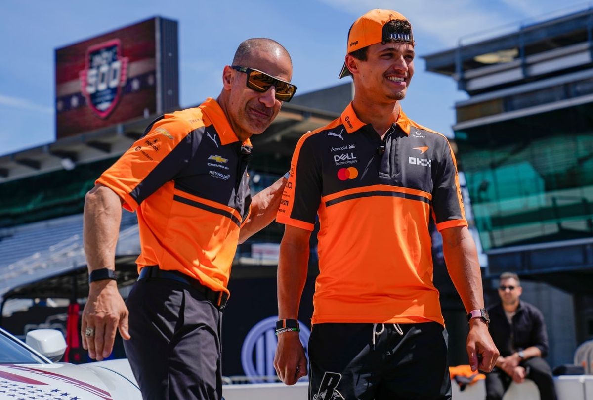 McLaren's Tony Kanaan pats McLaren Formula 1 driver Lando Norris on the back Monday, May 25, 2026, the day after the 110th running of the Indianapolis 500 at Indianapolis Motor Speedway.