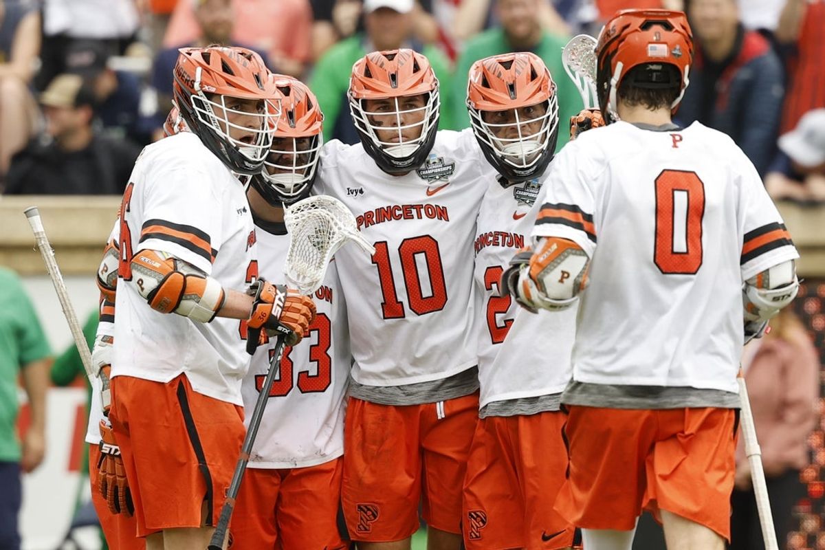 May 25, 2026; Charlottesville, VA, USA; Princeton Tigers attack Chad Palumbo (10) celebrates with teammates after scoring a goal against the Notre Dame Fighting Irish during the first quarter in the NCAA Mens Lacrosse National Championship game at Scott Stadium. Mandatory Credit: Geoff Burke-Imagn Images