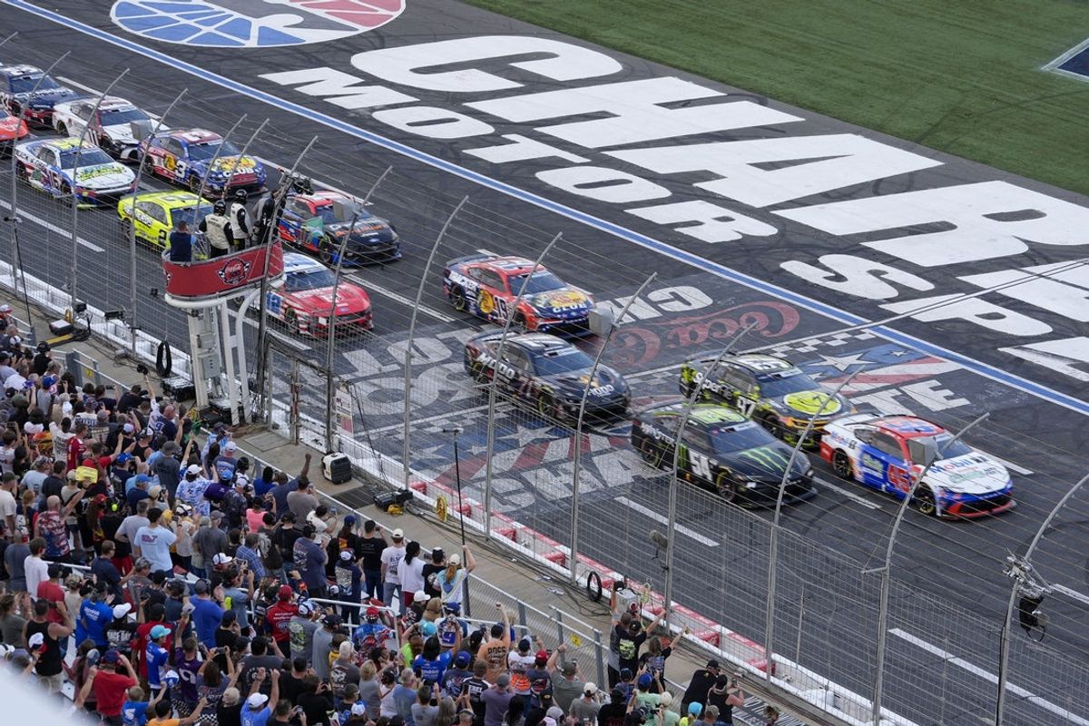 May 24, 2026; Concord, North Carolina, USA; 23XI Racing driver Tyler Reddick (45) and Joe Gibbs Racing driver Ty Gibbs (54) lead the field at the start during the Coca-Cola 600 at Charlotte Motor Speedway. Mandatory Credit: Jim Dedmon-Imagn Images