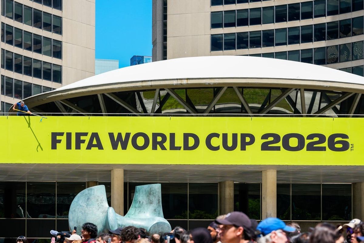 May 25, 2026; Toronto, ON, CAN; Toronto city worker cleans a sign outside of city hall during the FIFA World Cup Trophy Tour by Coca-Cola at Nathan Phillips Square. Mandatory Credit: Kevin Sousa-Imagn Images