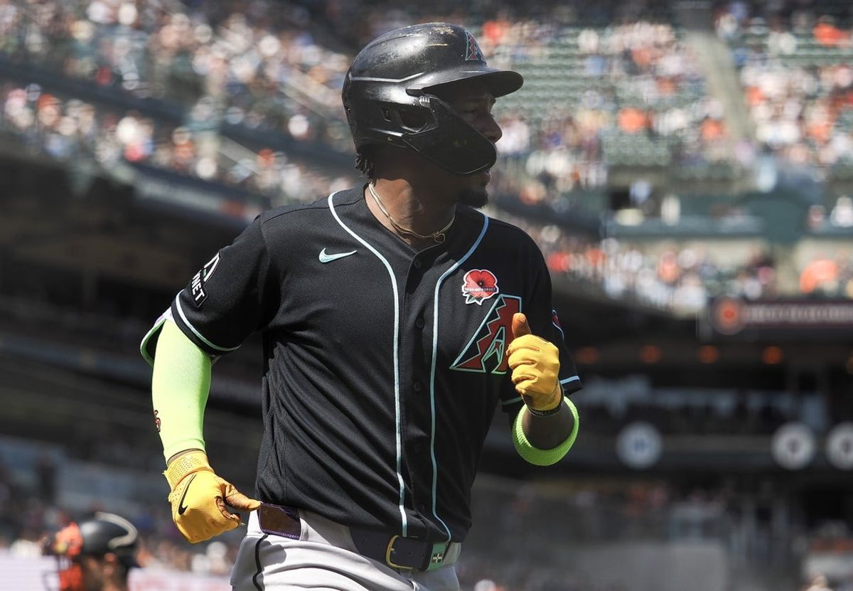 May 25, 2026; San Francisco, California, USA; Arizona Diamondbacks shortstop Geraldo Perdomo (2) jogs to dugout after scoring a run against the San Francisco Giants during the fifth inning at Oracle Park. Mandatory Credit: Kelley L Cox-Imagn Images
