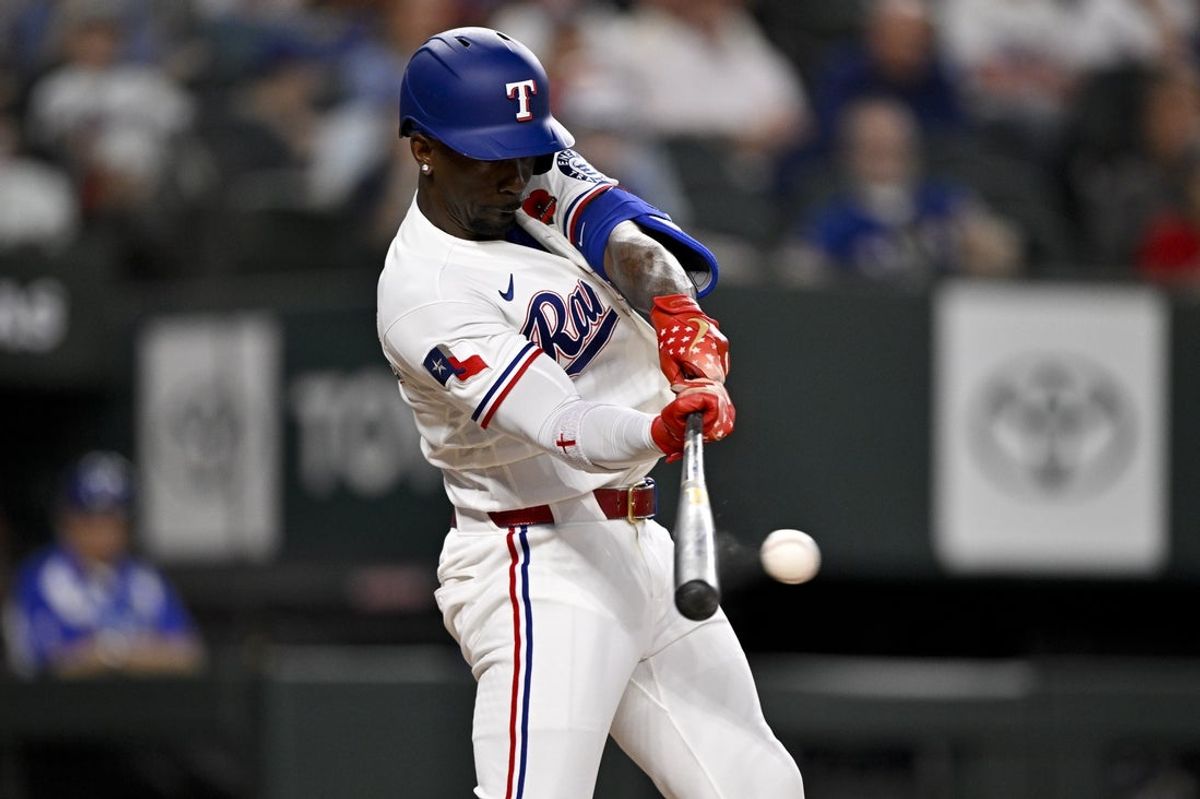 May 25, 2026; Arlington, Texas, USA;  Texas Rangers right fielder Andrew McCutchen (4) bats against the Houston Astros during the second inning at Globe Life Field. Mandatory Credit: Jerome Miron-Imagn Images