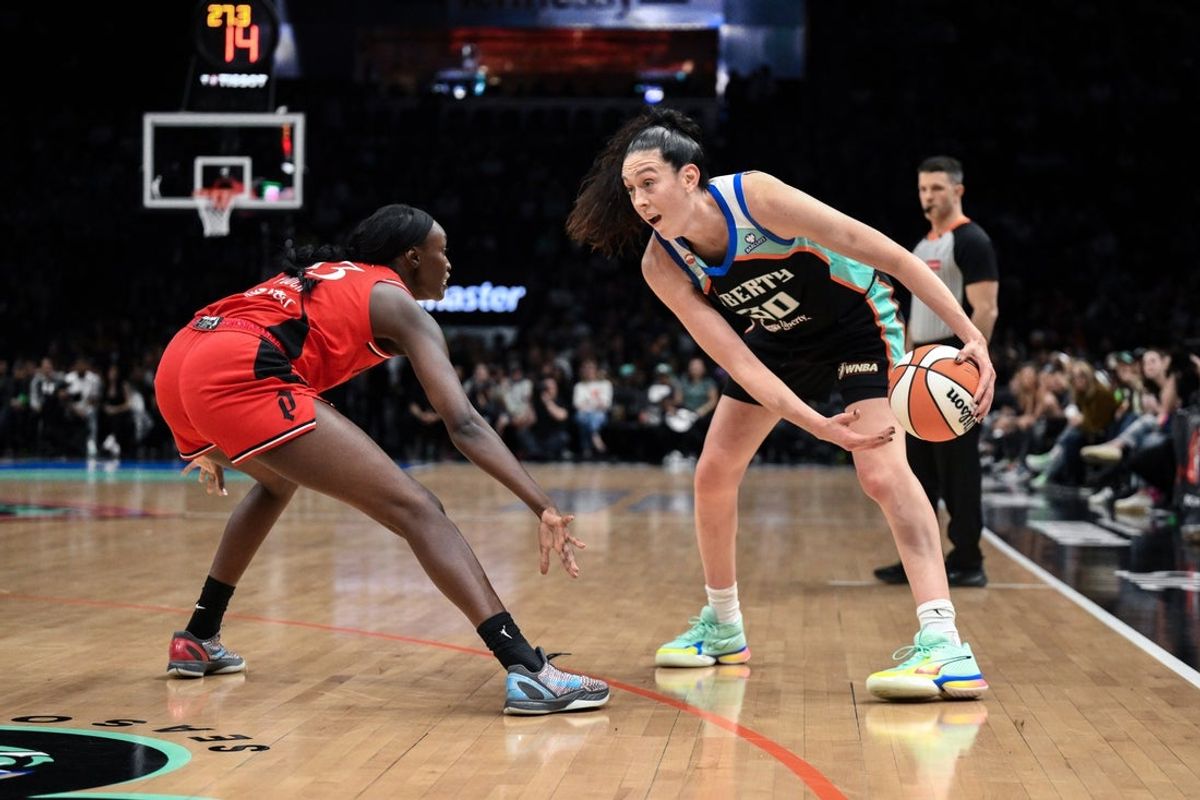 May 25, 2026; Brooklyn, New York, USA; New York Liberty forward Breanna Stewart (30) tries to drive past Portland Fire forward Nyadiew Puoch (13) during the first half at Barclays Center. Mandatory Credit: John Jones-Imagn Images