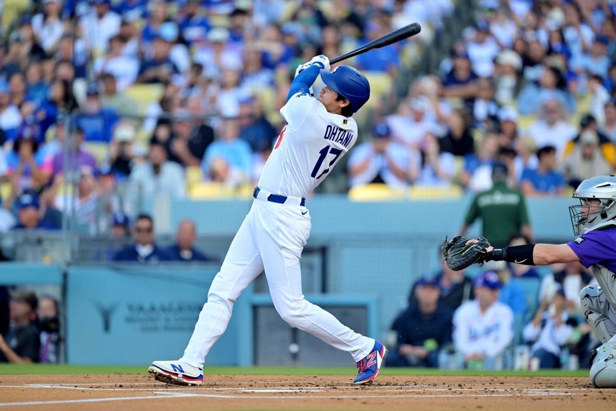 May 25, 2026; Los Angeles, California, USA; Los Angeles Dodgers starting pitcher Shohei Ohtani (17) hits a double against the Colorado Rockies in the first inning at Dodger Stadium. Mandatory Credit: Jayne Kamin-Oncea-Imagn Images