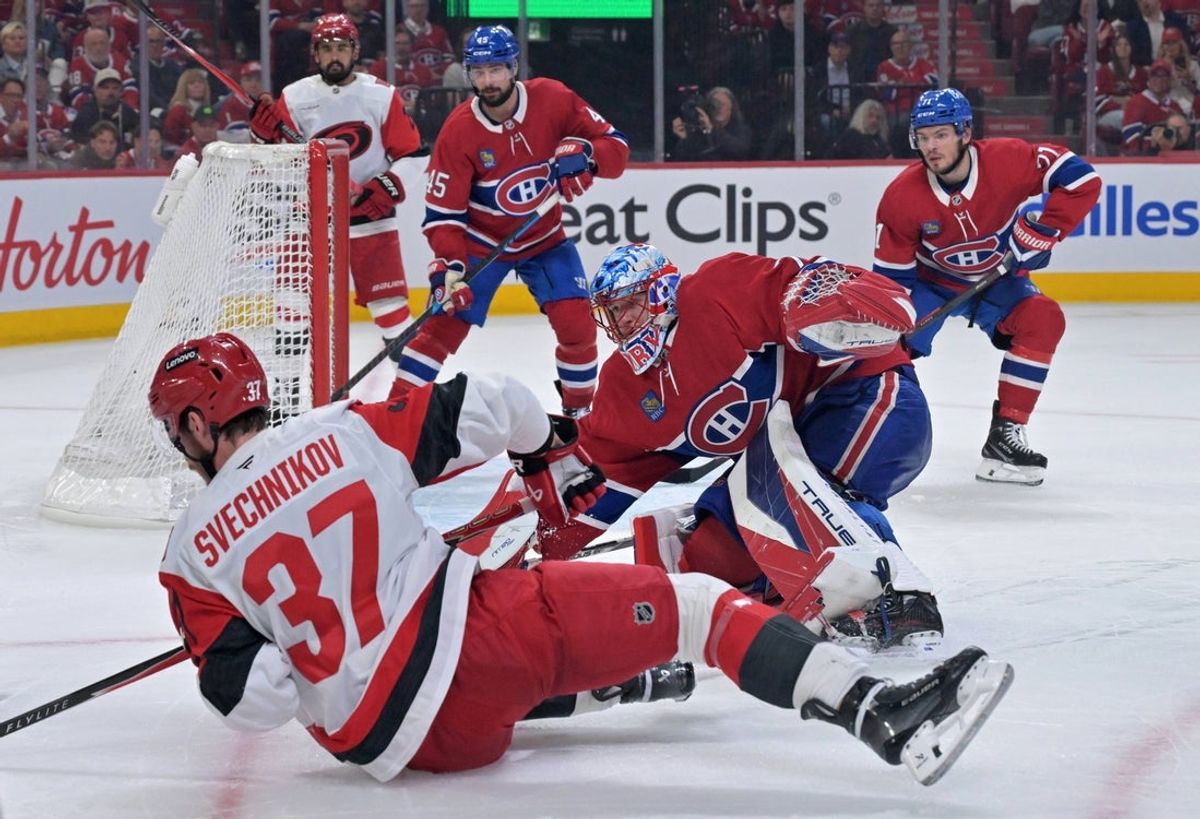 May 25, 2026; Montreal, Quebec, CAN; Montreal Canadiens goaltender Jakub Dobes (75) defends Carolina Hurricanes right wing Andrei Svechnikov (37) during the second period in game three of the Eastern Conference Final of the 2026 Stanley Cup Playoffs at Bell Centre. Mandatory Credit: Eric Bolte-Imagn Images