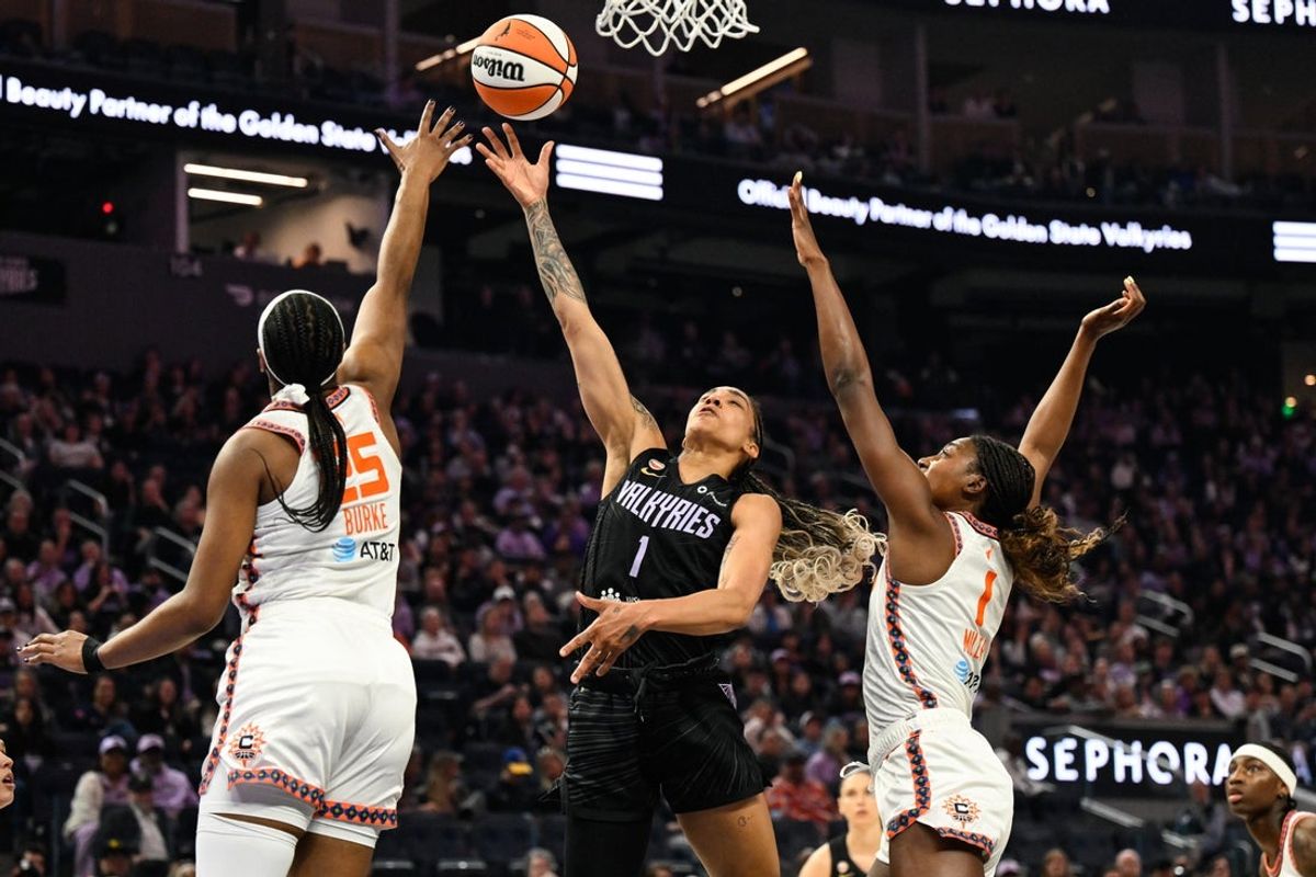 May 25, 2026; San Francisco, California, USA; Golden State Valkyries forward Gabby Williams (1) shoots against Connecticut Sun forward Diamond Miller (1) and Connecticut Sun guard Kennedy Burke (25) in the first quarter at Chase Center. Mandatory Credit: Eakin Howard-Imagn Images