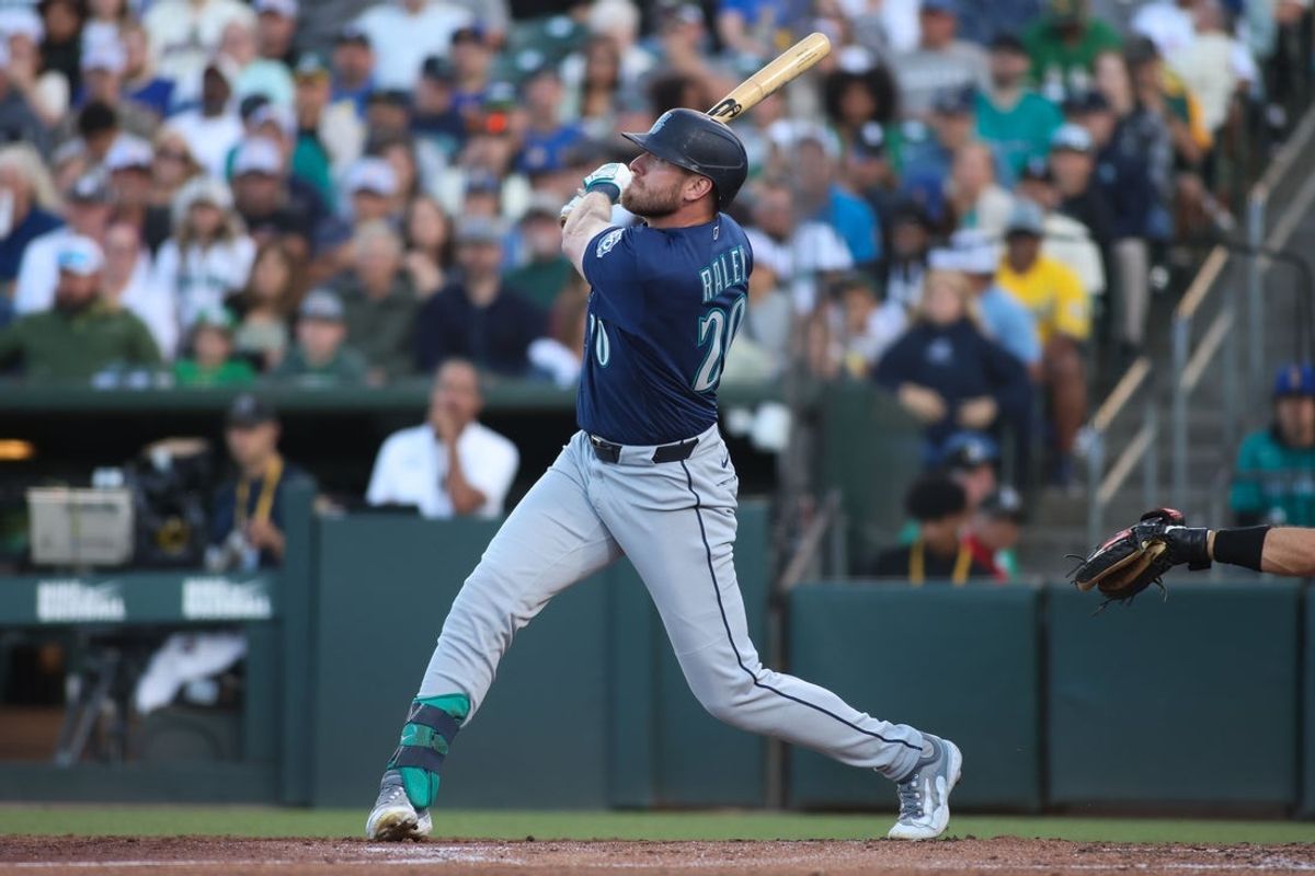 May 25, 2026; West Sacramento, California, USA; Seattle Mariners right fielder Luke Raley (20) hits a two run home run during the third inning against the Athletics at Sutter Health Park. Mandatory Credit: Scott Marshall-Imagn Images