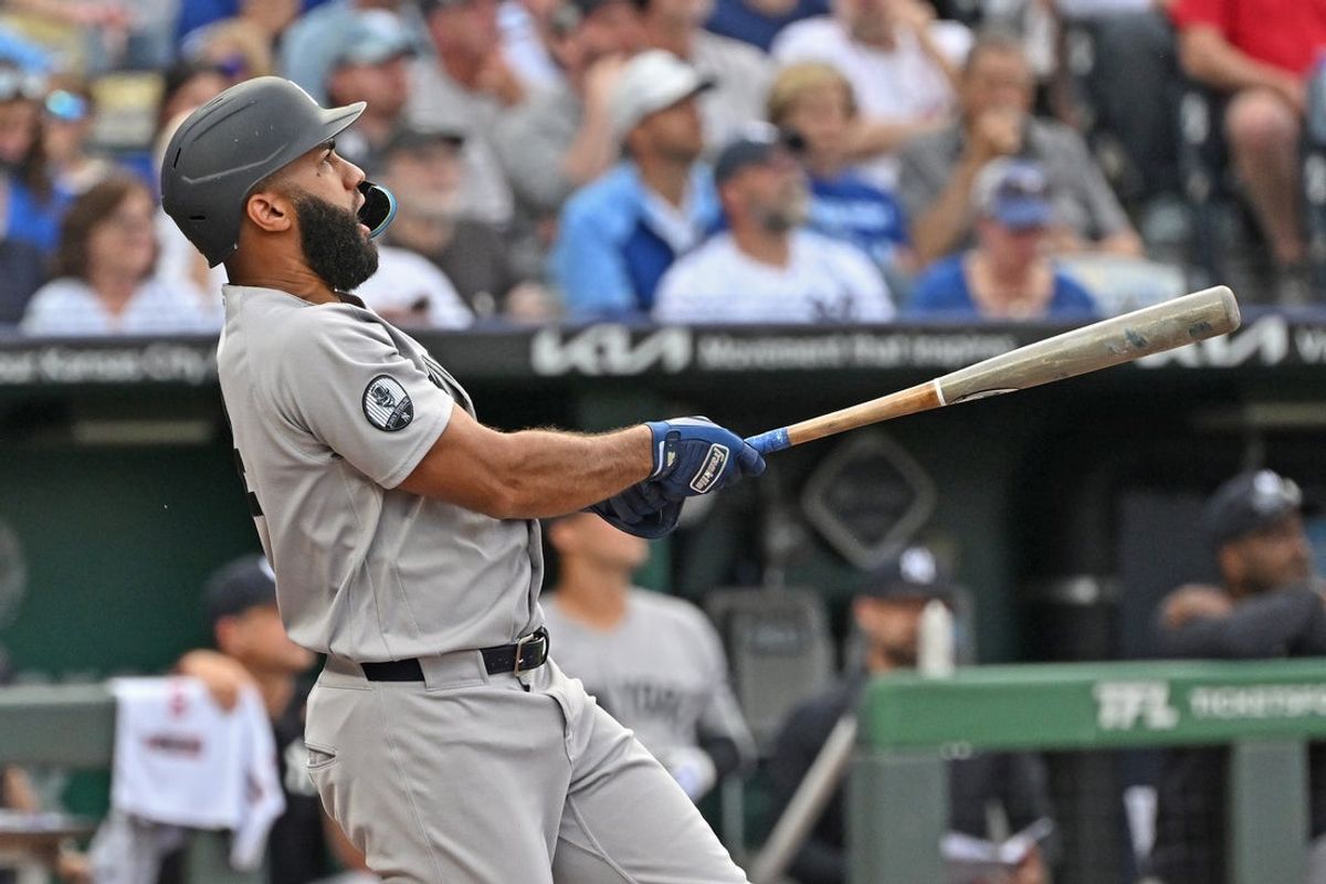 May 26, 2026; Kansas City, Missouri, USA;  New York Yankees third baseman Amed Rosario (14) hits a two-run home run in the first inning against the Kansas City Royals at Kauffman Stadium. Mandatory Credit: Peter Aiken-Imagn Images