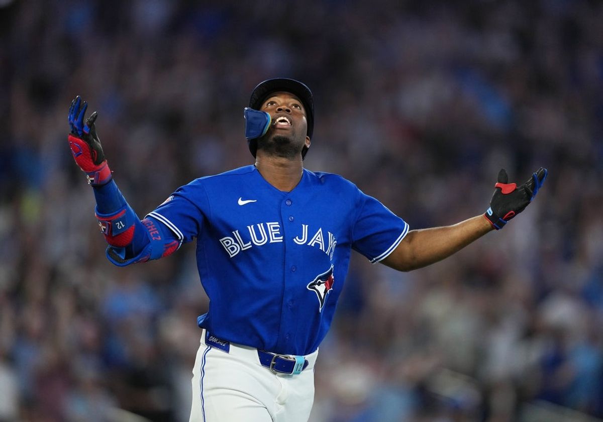 May 26, 2026; Toronto, Ontario, CAN; Toronto Blue Jays right fielder Jesus Sanchez (12) celebrates after hitting a grand slam home run against the Miami Marlins during the sixth inning at the Rogers Centre. Mandatory Credit: Nick Turchiaro-Imagn Images