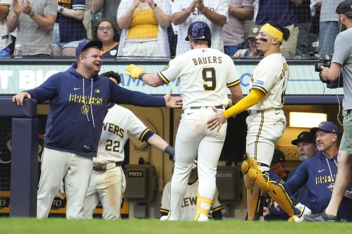 May 26, 2026; Milwaukee, Wisconsin, USA; Milwaukee Brewers first baseman Jake Bauers (9) is congratulated by Milwaukee Brewers hitting coach Daniel Vogelbach (92), left and Milwaukee Brewers catcher William Contreras (24) after a home run against the St. Louis Cardinals in the fourth inning at American Family Field. Mandatory Credit: Michael McLoone-Imagn Images
