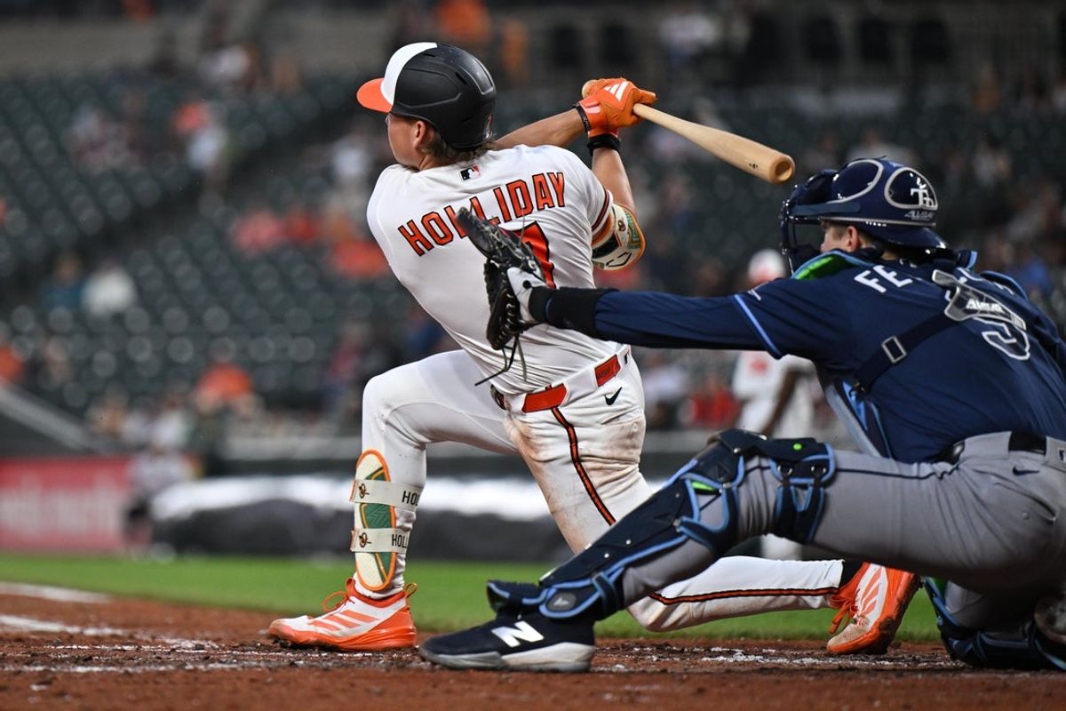 May 26, 2026; Baltimore, Maryland, USA;  Baltimore Orioles infielder Jackson Holliday (7) hits a single in the fifth inning against the Tampa Bay Rays at Oriole Park at Camden Yards. Mandatory Credit: Jamie Sabau-Imagn Images