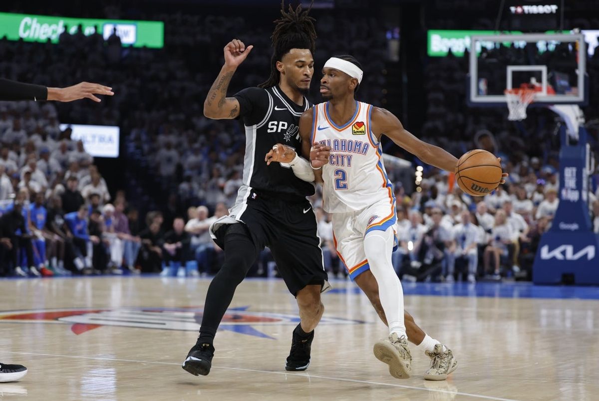 May 26, 2026; Oklahoma City, Oklahoma, USA; Oklahoma City Thunder guard Shai Gilgeous-Alexander (2) drives against San Antonio Spurs guard Stephon Castle (5) during the third quarter in game five of the western conference finals for the 2026 NBA playoffs at Paycom Center. Mandatory Credit: Alonzo Adams-Imagn Images