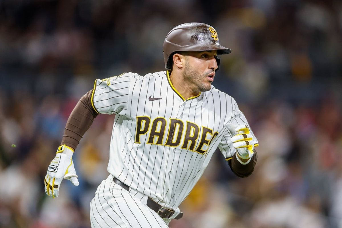 May 26, 2026; San Diego, California, USA; San Diego Padres right fielder Ramon Laureano (5) hits a one run home run during the eighth inning against the Philadelphia Phillies at Petco Park. Mandatory Credit: David Frerker-Imagn Images