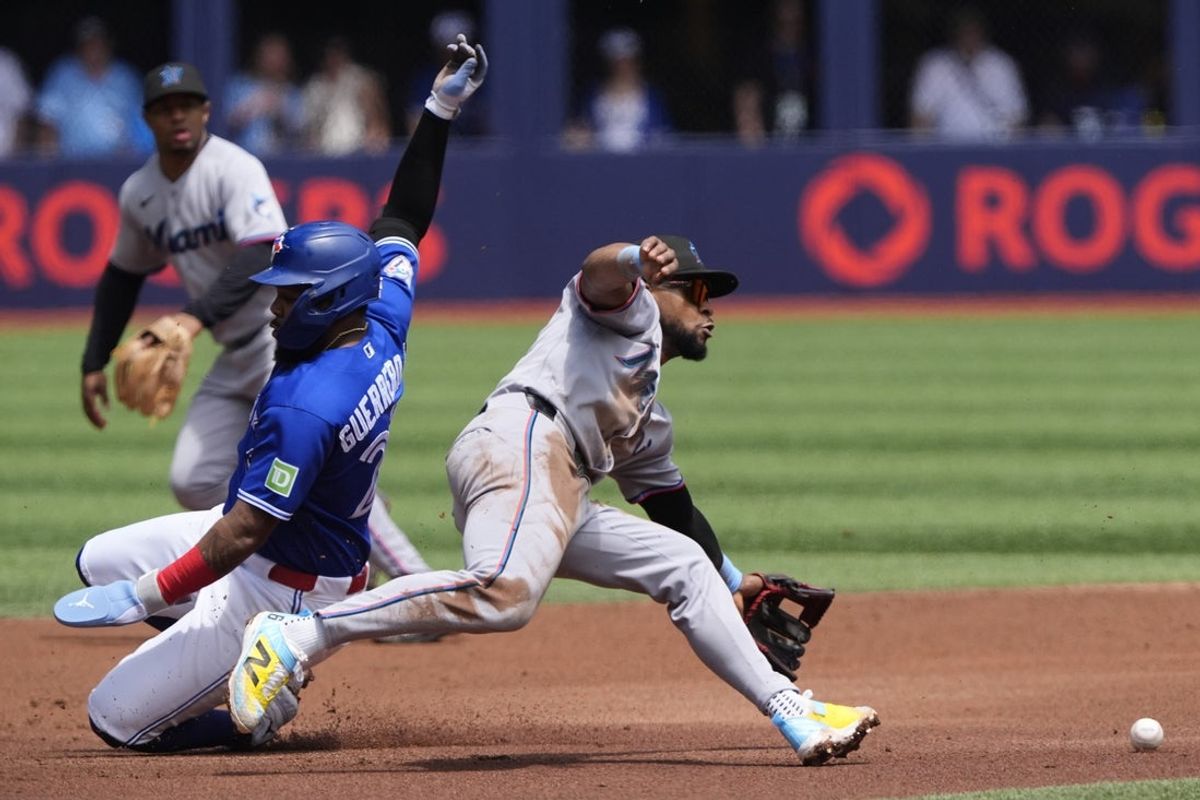 May 27, 2026; Toronto, Ontario, CAN; Toronto Blue Jays first baseman Vladimir Guerrero Jr. (27) steals second base against Miami Marlins shortstop Otto Lopez (6) during the first inning at Rogers Centre. Mandatory Credit: John E. Sokolowski-Imagn Images