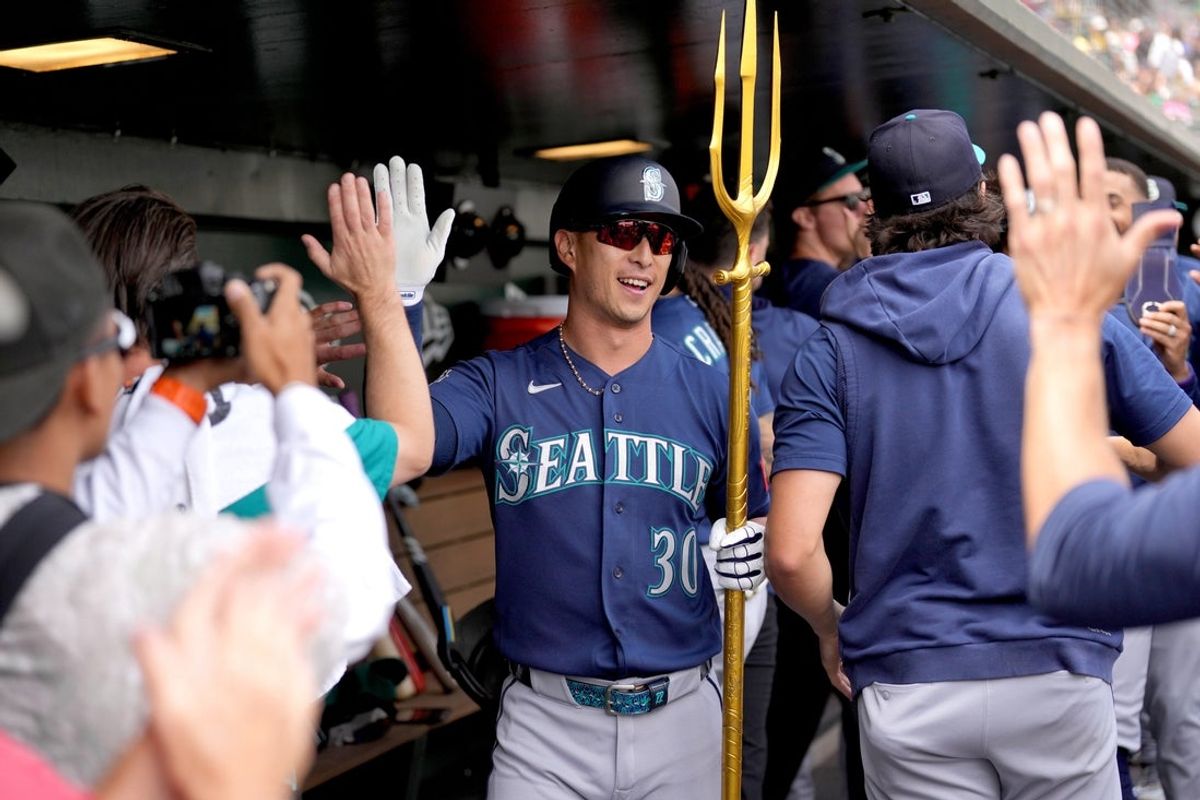 May 27, 2026; West Sacramento, California, USA; Seattle Mariners left fielder Rob Refsnyder (30) is congratulated by teammates after hitting a three-run home run against the Athletics in the first inning at Sutter Health Park. Mandatory Credit: Cary Edmondson-Imagn Images