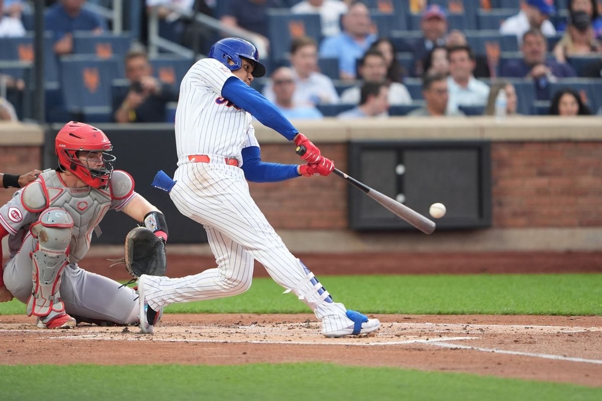 May 27, 2026; New York City, New York, USA; New York Mets left fielder Juan Soto (22) hits a home run against the Cincinnati Reds during the first inning at Citi Field. Mandatory Credit: Gregory Fisher-Imagn Images