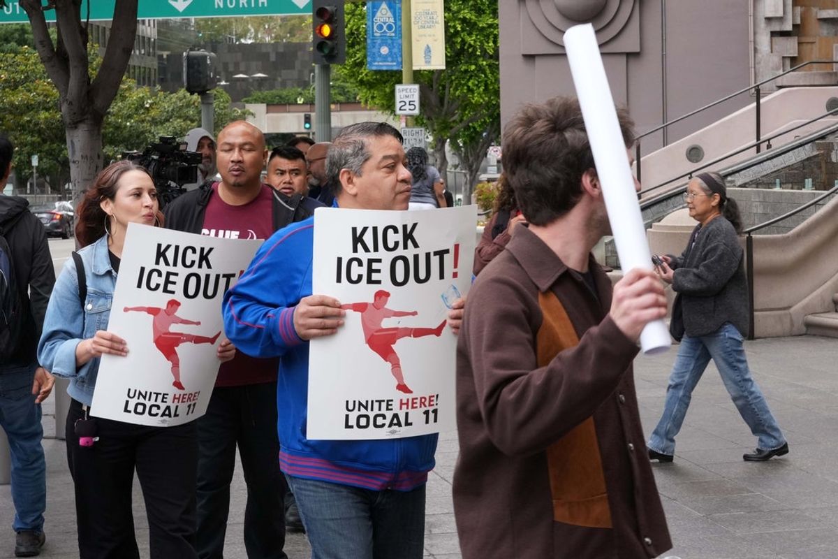 May 27, 2026; Los Angeles, CA, USA; Sofi Stadium worker Alex Mejia protests with Immigrant rights advocates and labor groups outside the FIFA Los Angeles World Cup 2026 Host Committee offices for changes to worker credential policies that they say could expose stadium workers and immigrant communities to immigration enforcement during the World Cup. Mandatory Credit: Kirby Lee-Imagn Images