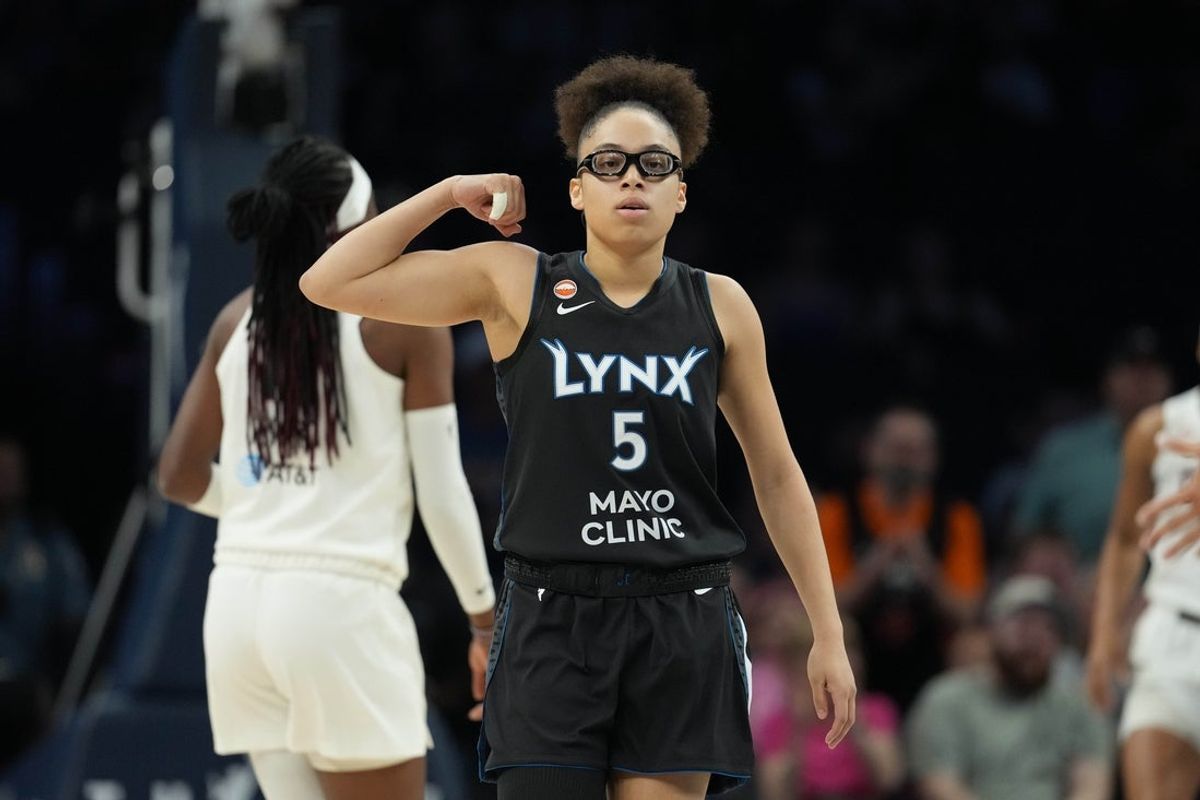 May 27, 2026; Minneapolis, Minnesota, USA; Minnesota Lynx guard Olivia Miles (5) flexes after making a shot against the Atlanta Dream in the first half at Target Center. Mandatory Credit: Jesse Johnson-Imagn Images