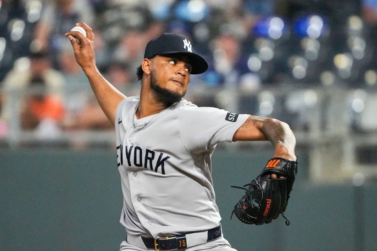 May 27, 2026; Kansas City, Missouri, USA; New York Yankees pitcher Camilo Doval (75) delivers a pitch against the Kansas City Royals during the ninth inning at Kauffman Stadium. Mandatory Credit: Denny Medley-Imagn Images