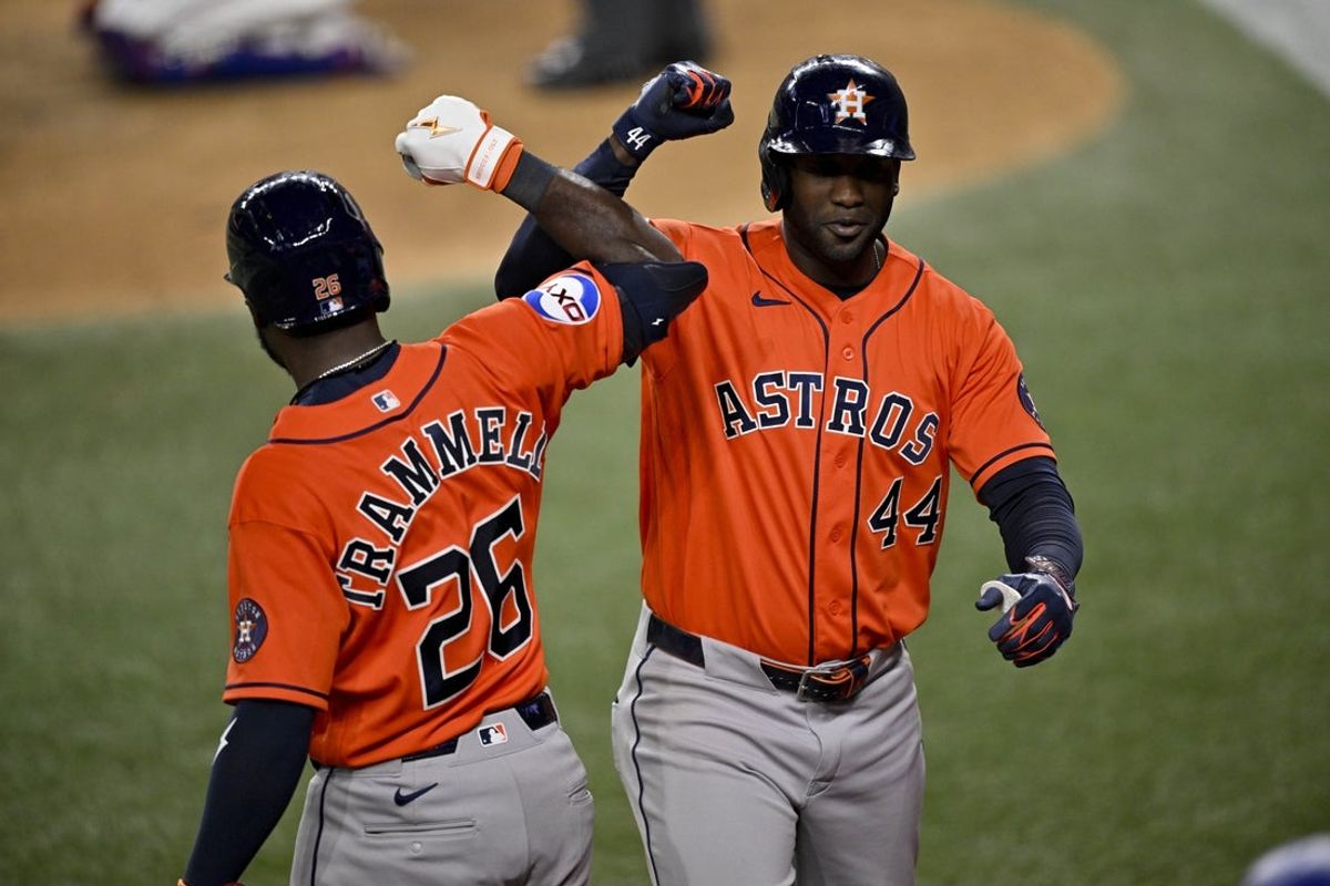 May 27, 2026; Arlington, Texas, USA;  Houston Astros designated hitter Yordan Alvarez (44) and left fielder Taylor Trammell (26) celebrate after Alvarez hits a go-ahead home run against the Texas Rangers during the eighth inning at Globe Life Field. Mandatory Credit: Jerome Miron-Imagn Images