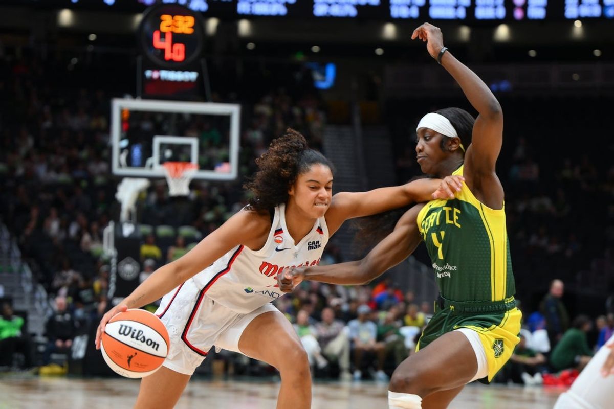 May 27, 2026; Seattle, Washington, USA; Seattle Storm guard Flau'jae Johnson (4) guards Washington Mystics guard Cassandre Prosper (18) during the first half at Climate Pledge Arena. Mandatory Credit: Steven Bisig-Imagn Images