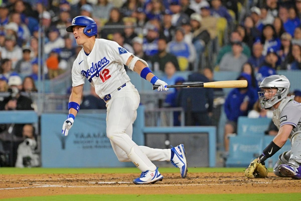 May 27, 2026; Los Angeles, California, USA; Los Angeles Dodgers left fielder Alex Call (12) hits an RBI single during the fourth inning against the Colorado Rockies at Dodger Stadium. Mandatory Credit: Jayne Kamin-Oncea-Imagn Images