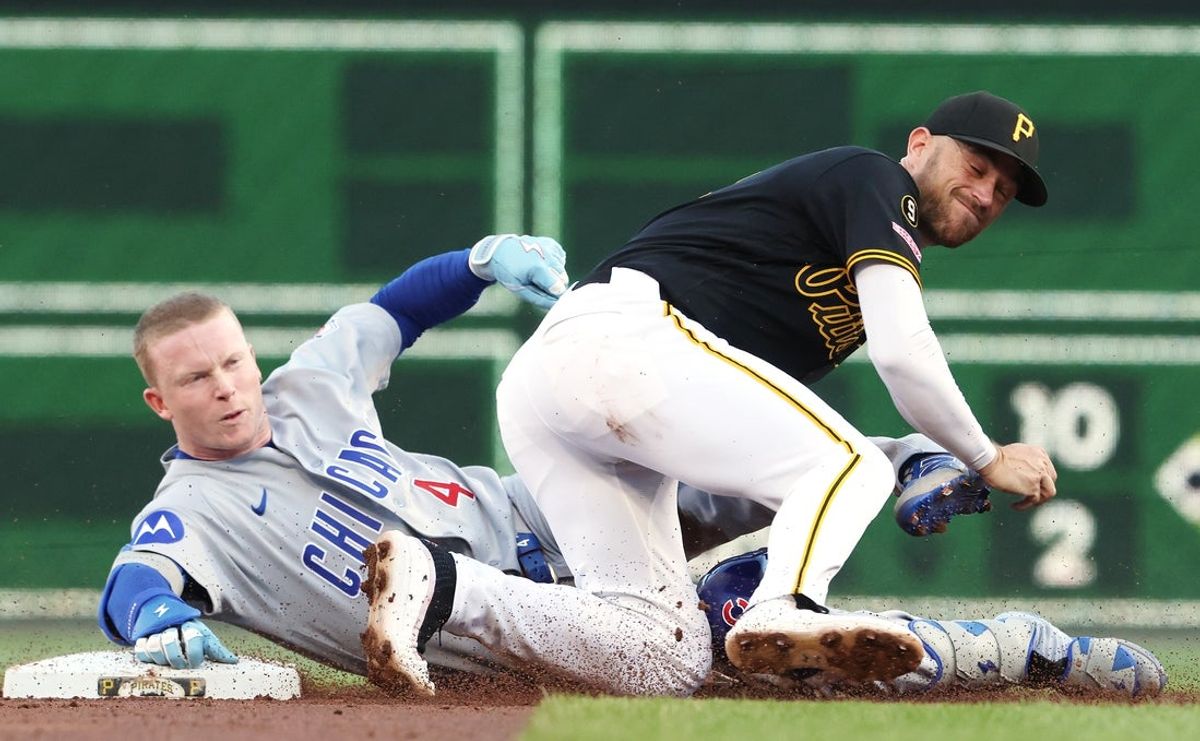 May 28, 2026; Pittsburgh, Pennsylvania, USA;  Pittsburgh Pirates second baseman Brandon Lowe (right) tags Chicago Cubs center fielder Pete Crow-Armstrong (4) out at second base attempting to stretch a single during the third inning at PNC Park. Mandatory Credit: Charles LeClaire-Imagn Images