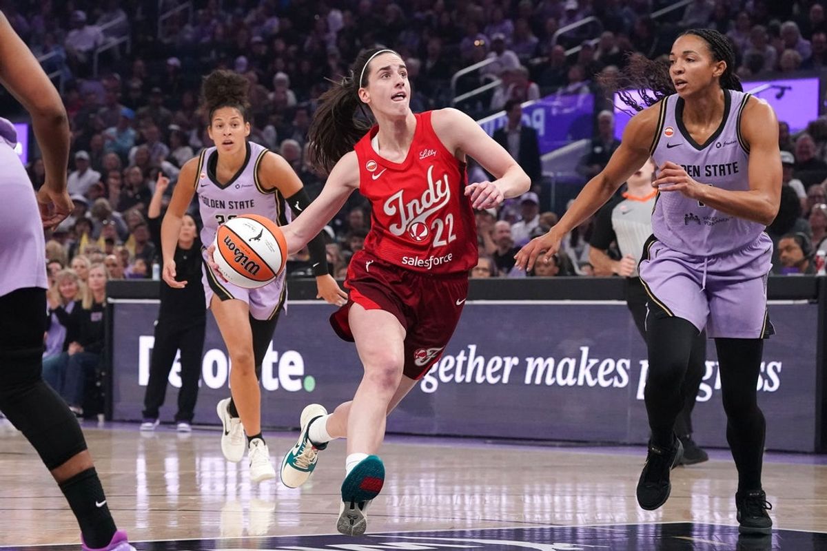 May 28, 2026; San Francisco, California, USA;  Indiana Fever guard Caitlin Clark (22) dribbles past Golden State Valkyries guard Veronica Burton (22) and is defended by center Kiah Stokes (41) in the first quarter at Chase Center. Mandatory Credit: David Gonzales-Imagn Images