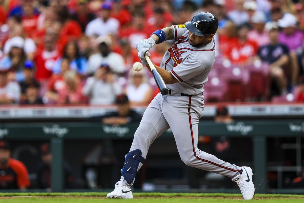 May 29, 2026; Cincinnati, Ohio, USA; Atlanta Braves designated hitter Dominic Smith (8) hits a single in the second inning against the Cincinnati Reds at Great American Ball Park. Mandatory Credit: Katie Stratman-Imagn Images