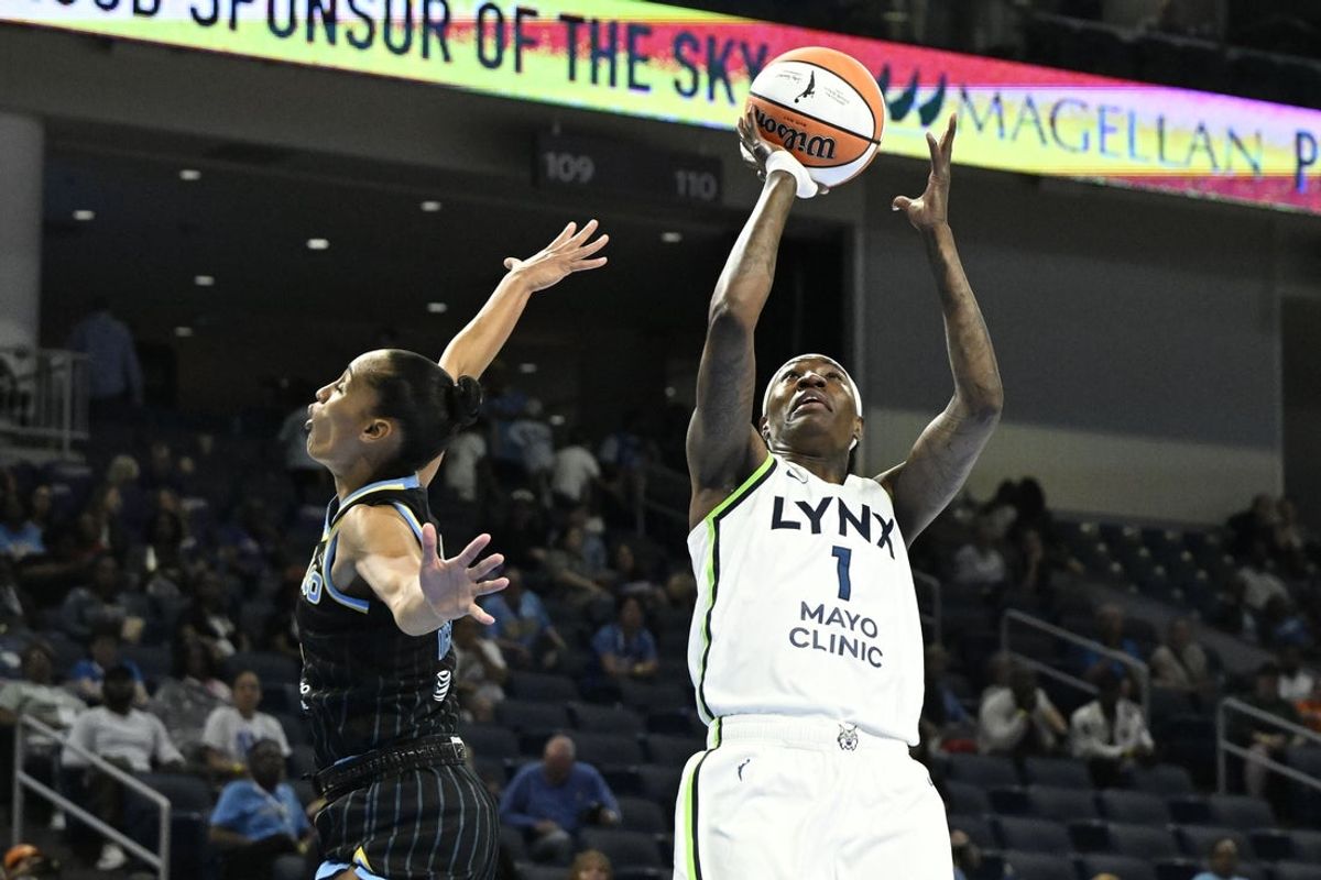 May 29, 2026; Chicago, Illinois, USA;  Minnesota Lynx forward Natasha Howard (1) shoots against Chicago Sky guard Skylar Diggins (4) during the first half at Wintrust Arena. Mandatory Credit: Matt Marton-Imagn Images