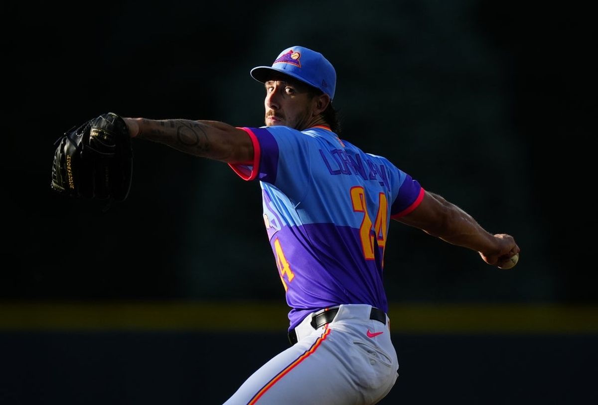 May 29, 2026; Denver, Colorado, USA; Colorado Rockies pitcher Michael Lorenzen (24) delivers a pitch in the first inning against the San Francisco Giants at Coors Field. Mandatory Credit: Ron Chenoy-Imagn Images
