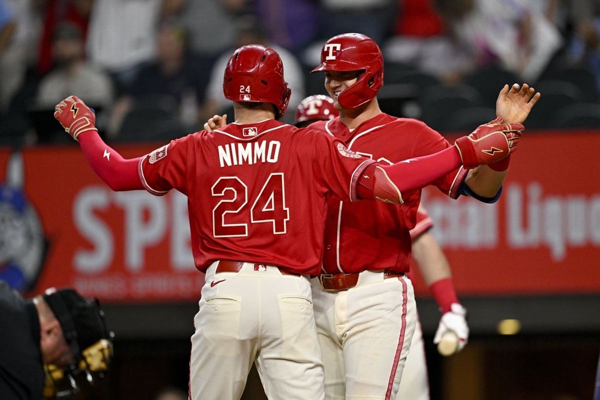 May 29, 2026; Arlington, Texas, USA;  Texas Rangers right fielder Brandon Nimmo (24) and third baseman Josh Jung (6) celebrate after Nimmo hits a two run home run against the Kansas City Royals during the fifth inning at Globe Life Field. Mandatory Credit: Jerome Miron-Imagn Images