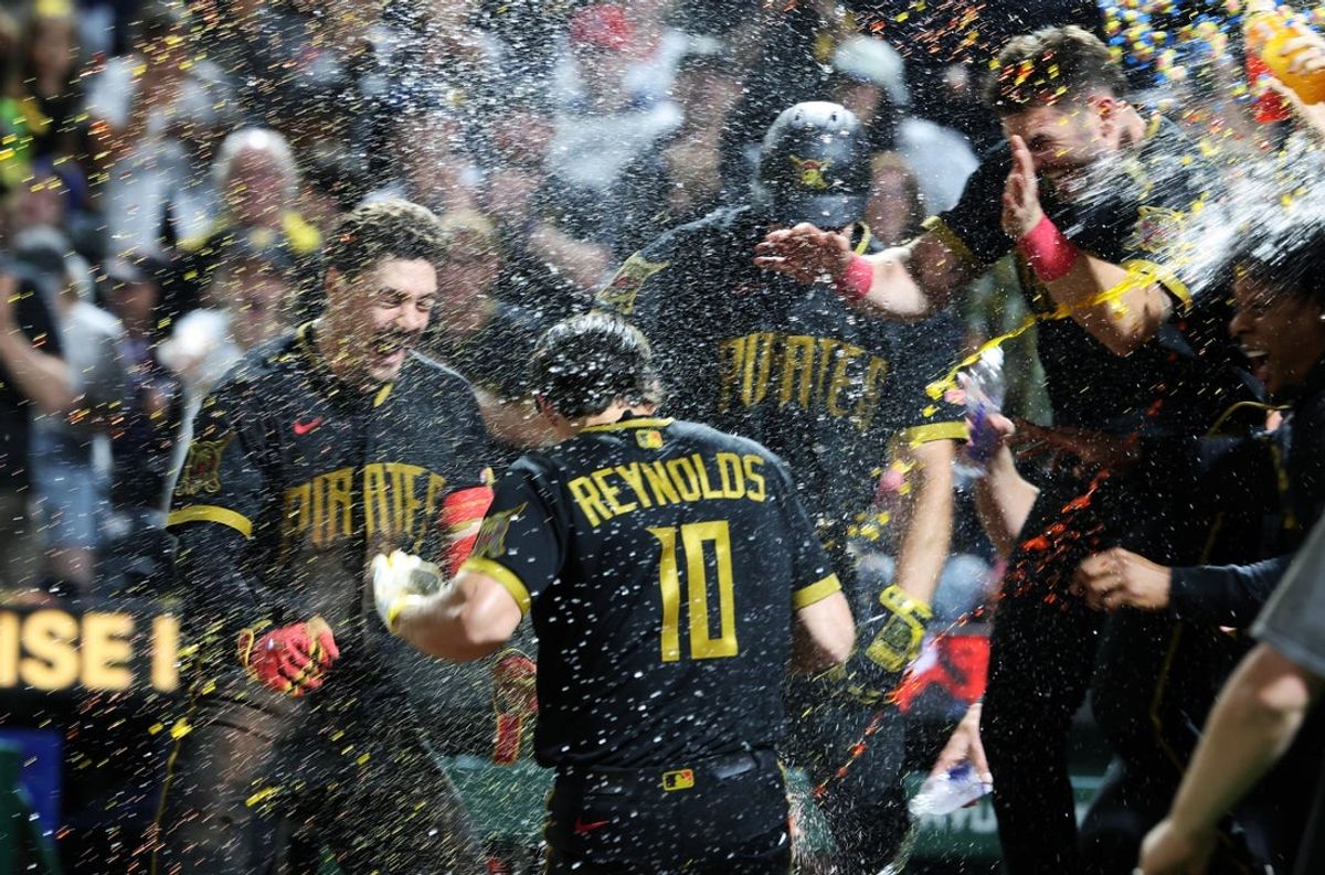May 29, 2026; Pittsburgh, Pennsylvania, USA;  Pittsburgh Pirates left fielder Bryan Reynolds (10) is mobbed at home plate after hitting a game winning two run walk off home run to defeat the Minnesota Twins at PNC Park. Mandatory Credit: Charles LeClaire-Imagn Images
