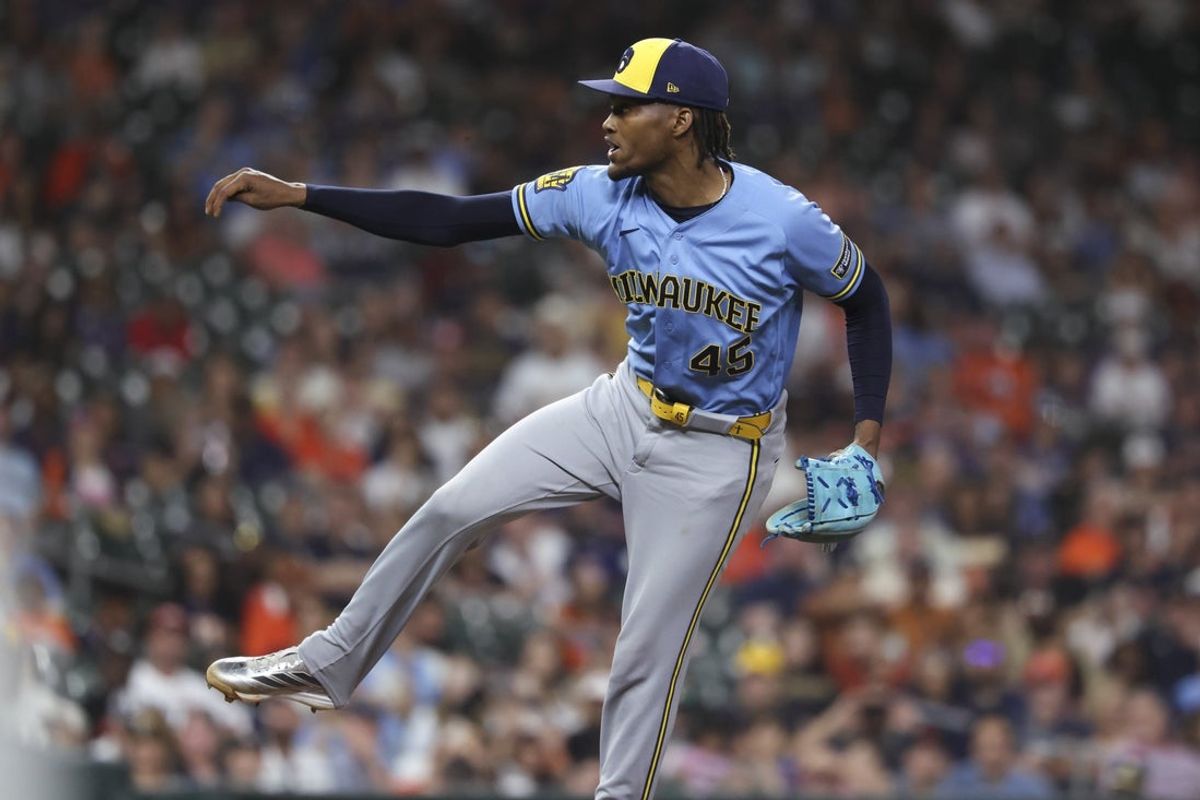 May 29, 2026; Houston, Texas, USA; Milwaukee Brewers pitcher Abner Uribe (45) delivers a pitch during the ninth inning against the Houston Astros at Daikin Park. Mandatory Credit: Troy Taormina-Imagn Images