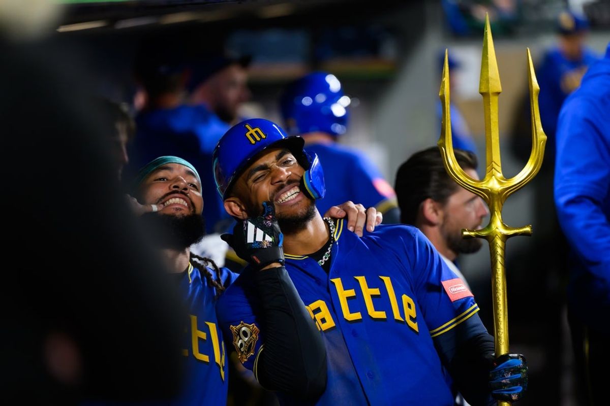 May 29, 2026; Seattle, Washington, USA; Seattle Mariners shortstop J.P. Crawford (3) and center fielder Julio Rodriguez (44) celebrate in the dugout after Rodriguez hit a 2-run home run against the Arizona Diamondbacks during the third inning at T-Mobile Park. Mandatory Credit: Steven Bisig-Imagn Images