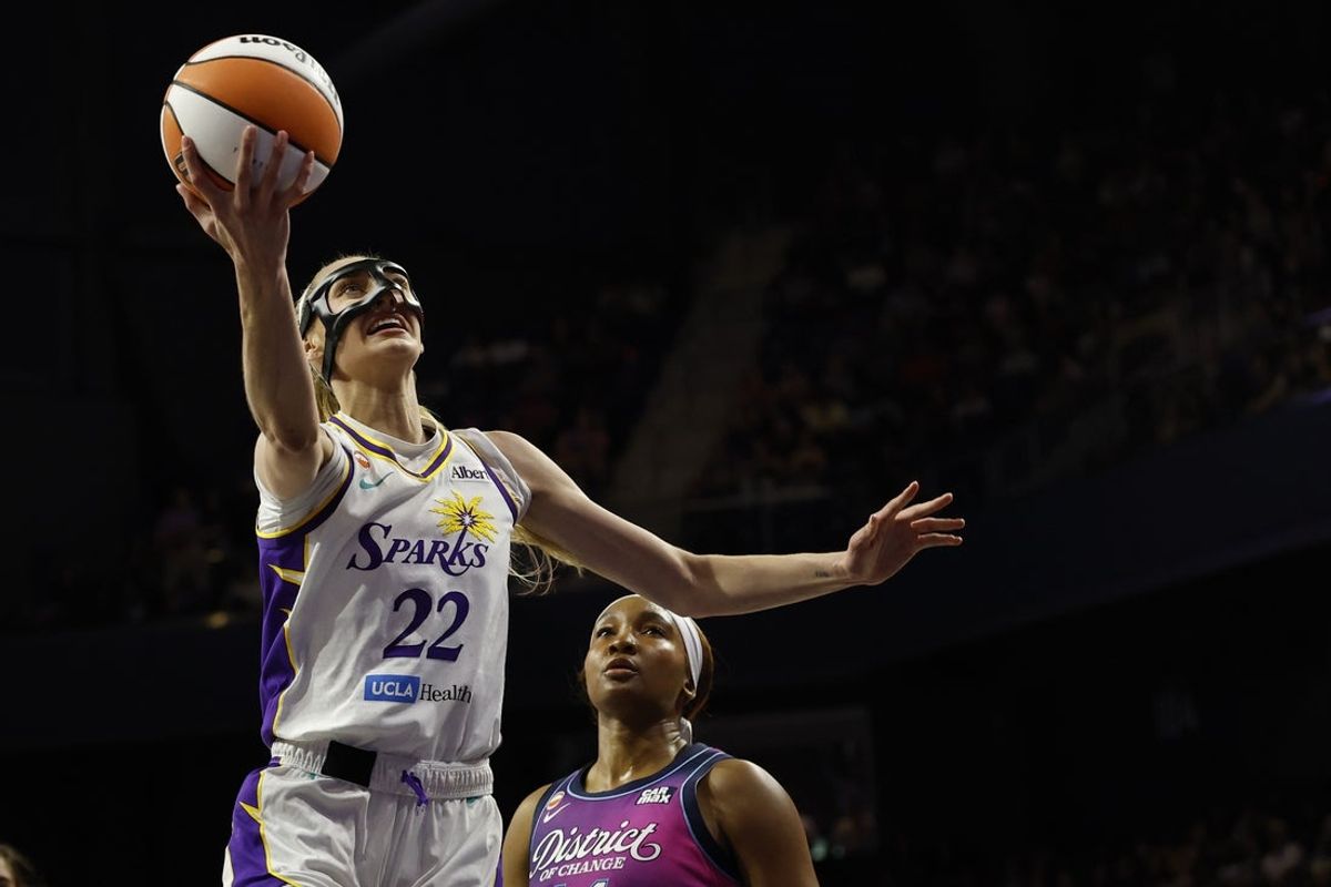 May 29, 2026; Washington, District of Columbia, USA; Los Angeles Sparks forward Cameron Brink (22) shoots the ball as Washington Mystics forward Kiki Iriafen (44) looks on in the first half at CareFirst Arena. Mandatory Credit: Geoff Burke-Imagn Images