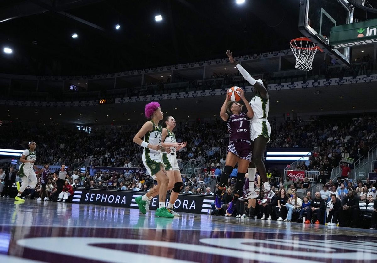 May 30, 2026; Toronto, Ontario, CAN; Toronto Tempo guard Kiki Rice (1) drives the basket as Seattle Storm center Awa Fam (11) tries to defend during the third quarter at Coca-Cola Coliseum. Mandatory Credit: Nick Turchiaro-Imagn Images